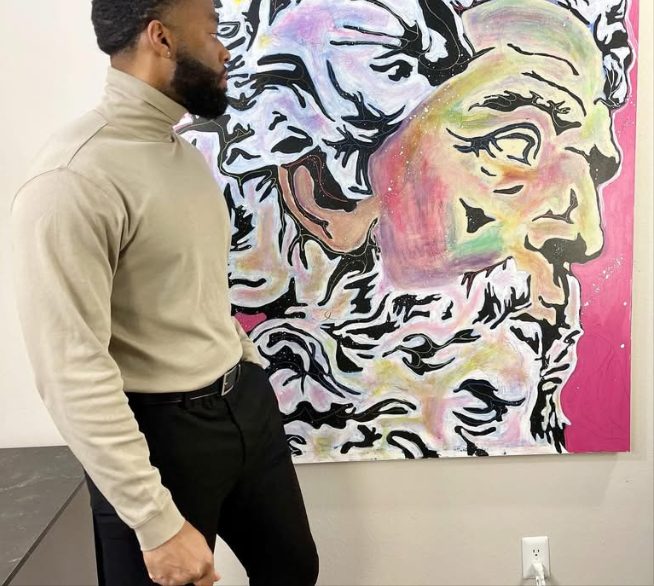 Willie Austin studying the pastel bust on the wall