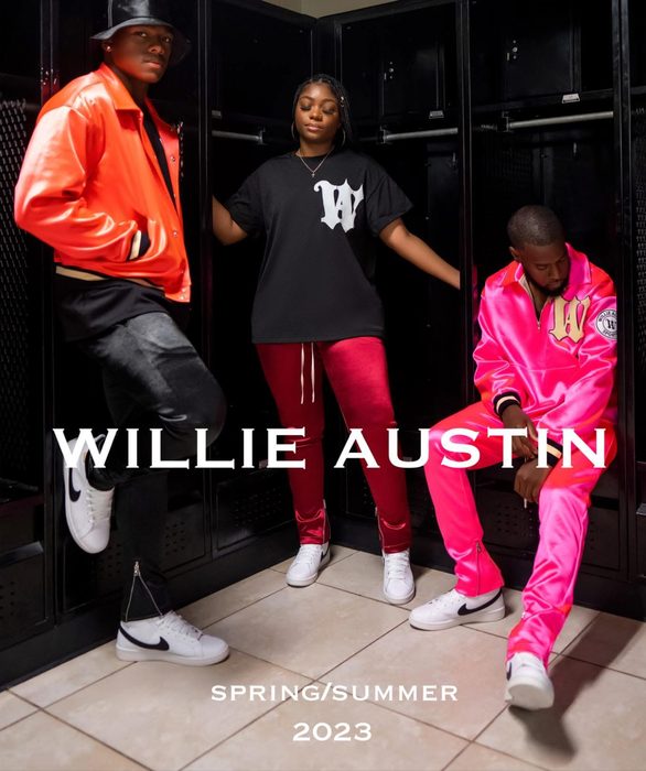 Three models in a locker room wearing Willie Austin pieces in orange, black and pink under the Willie Austin wordmark