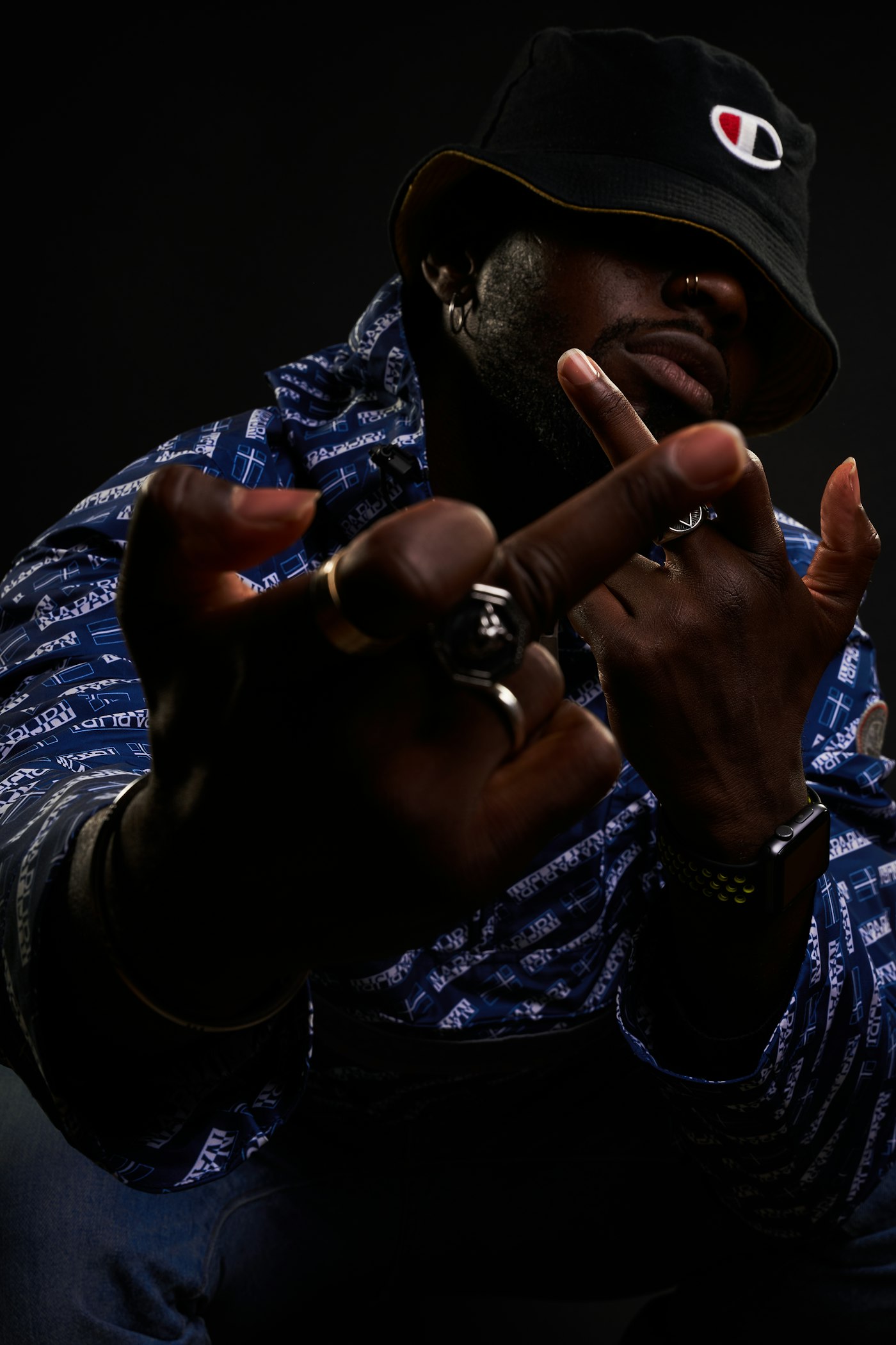 Willie Austin — dramatic portrait of the designer in studio lighting